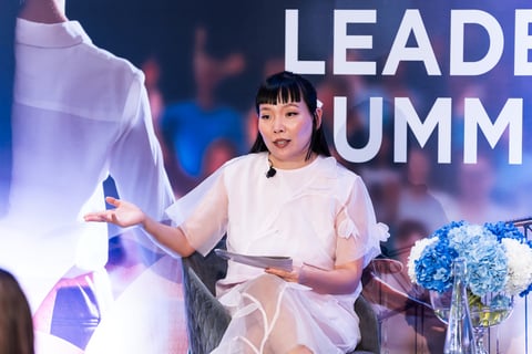 Dami Im speaking on stage at the Women in Leadership Summit Sydney 2025