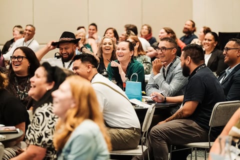 The audience laughing during a session at the Māori Leadership Summit 2025