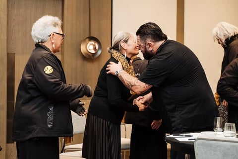 Delegates exchanging a hongi during the pōwhiri at the Māori Leadership Summit 2025