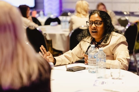A delegate making a point during a table discussion at the Women in Leadership Summit Melbourne 2026
