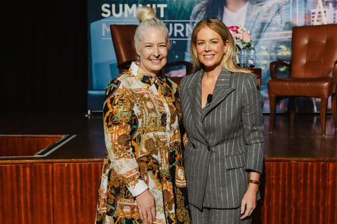 Two attendees in front of the stage at the Women in Leadership Summit Melbourne 2026