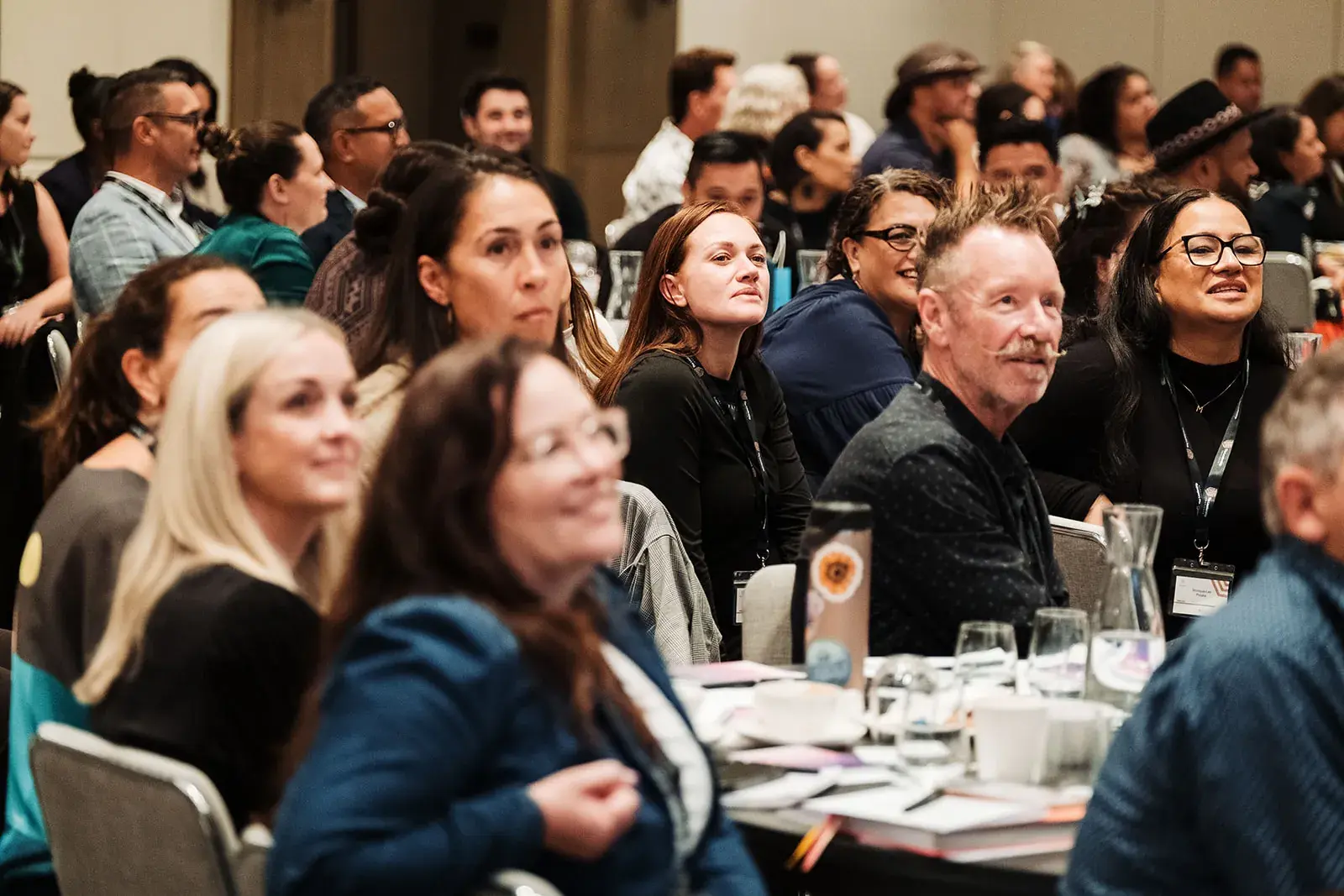 The audience smiling during a keynote at the Māori Leadership Summit 2025