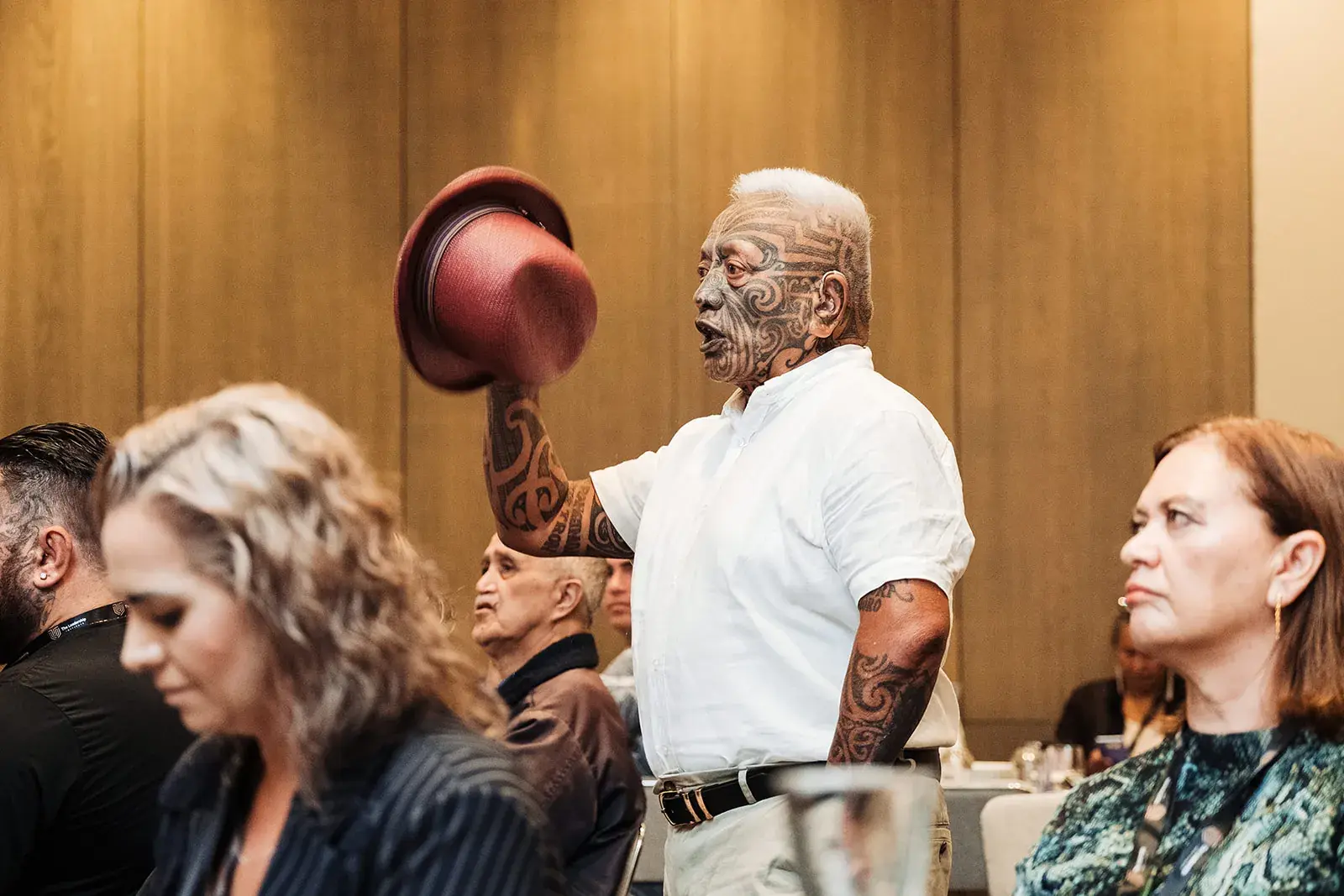 Tāme Iti raising his hat to delegates at the Māori Leadership Summit 2025